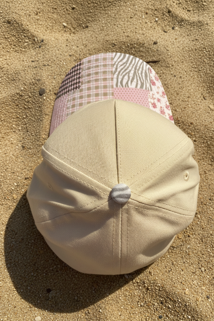 Top of a Beige hat with patchwork brim. 