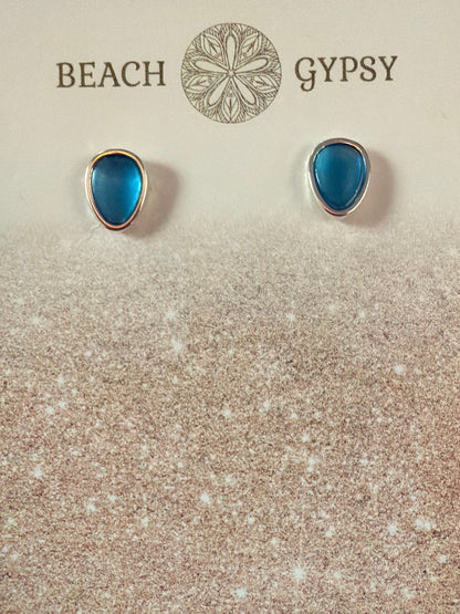 Blue teardrop earrings on a 'Gypsy Beach' branded card with a purple background