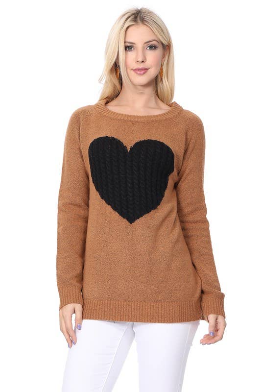 Woman wearing a brown sweater with a black heart design on a white background