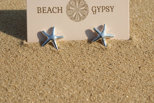 Silver starfish earrings on a beige card with 'Beach Gypsy' branding.