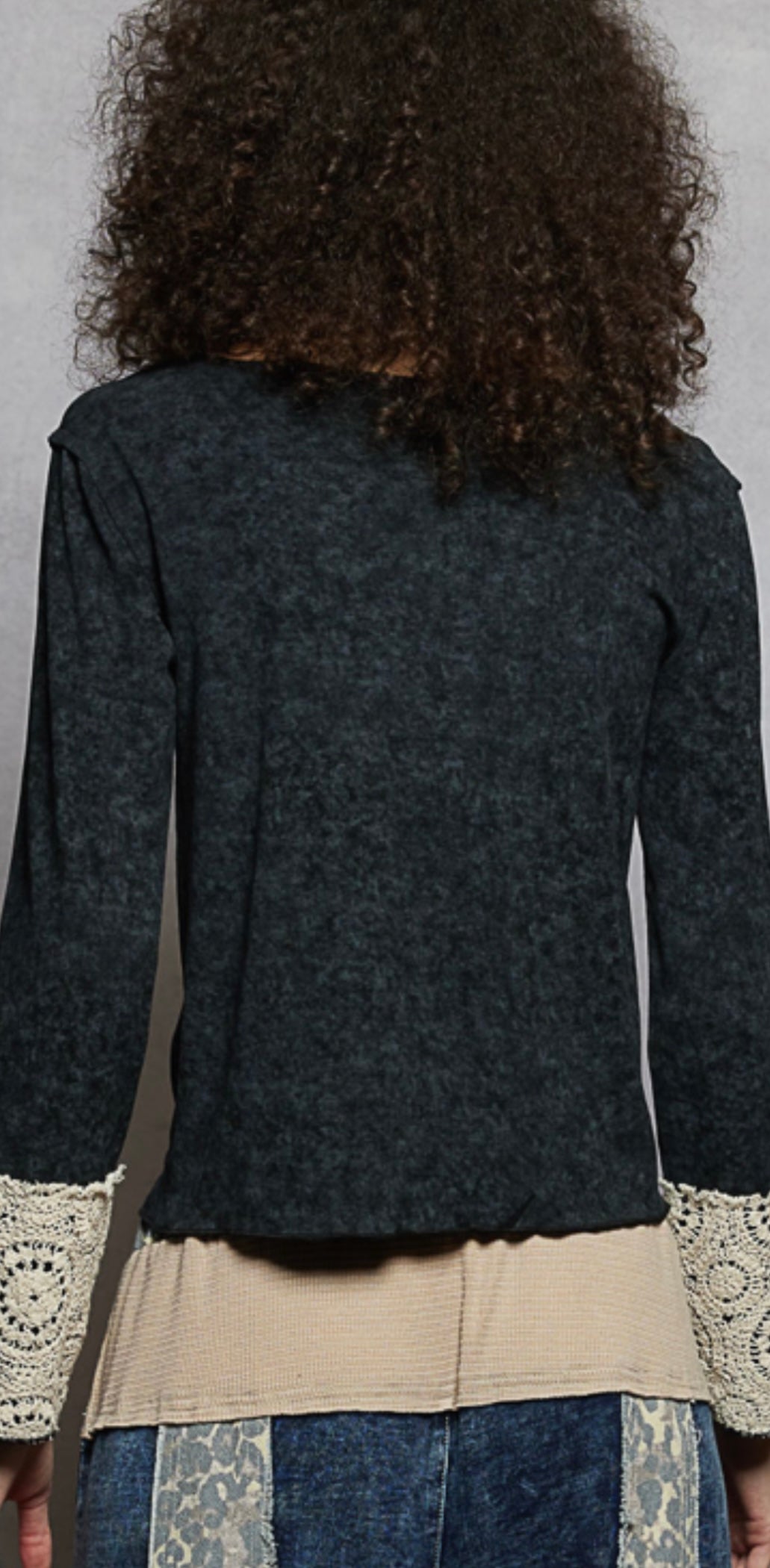 Black top with buttons and lace sleeve cuffs back view 