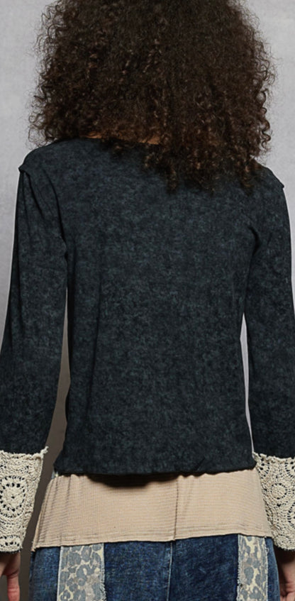 Black top with buttons and lace sleeve cuffs back view 