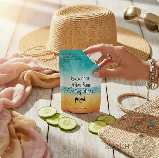 Hand reaching for a pack of aloe cucumber mask on a table with sunglasses and a hst