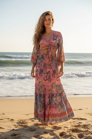 Wrap top and long smocked skirt on a woman standing on beach