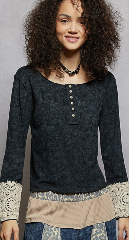 Black top with buttons and lace sleeve cuffs