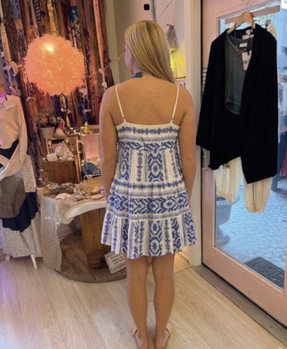 Woman wearing a blue and white patterned dress in Beach Gypsy, a boutique in downtown Berlin, MD which is minutes from Ocean City