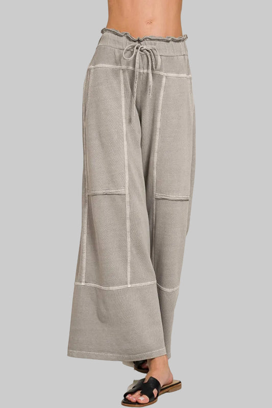Gray wide-leg pants with drawstring waist on a white background