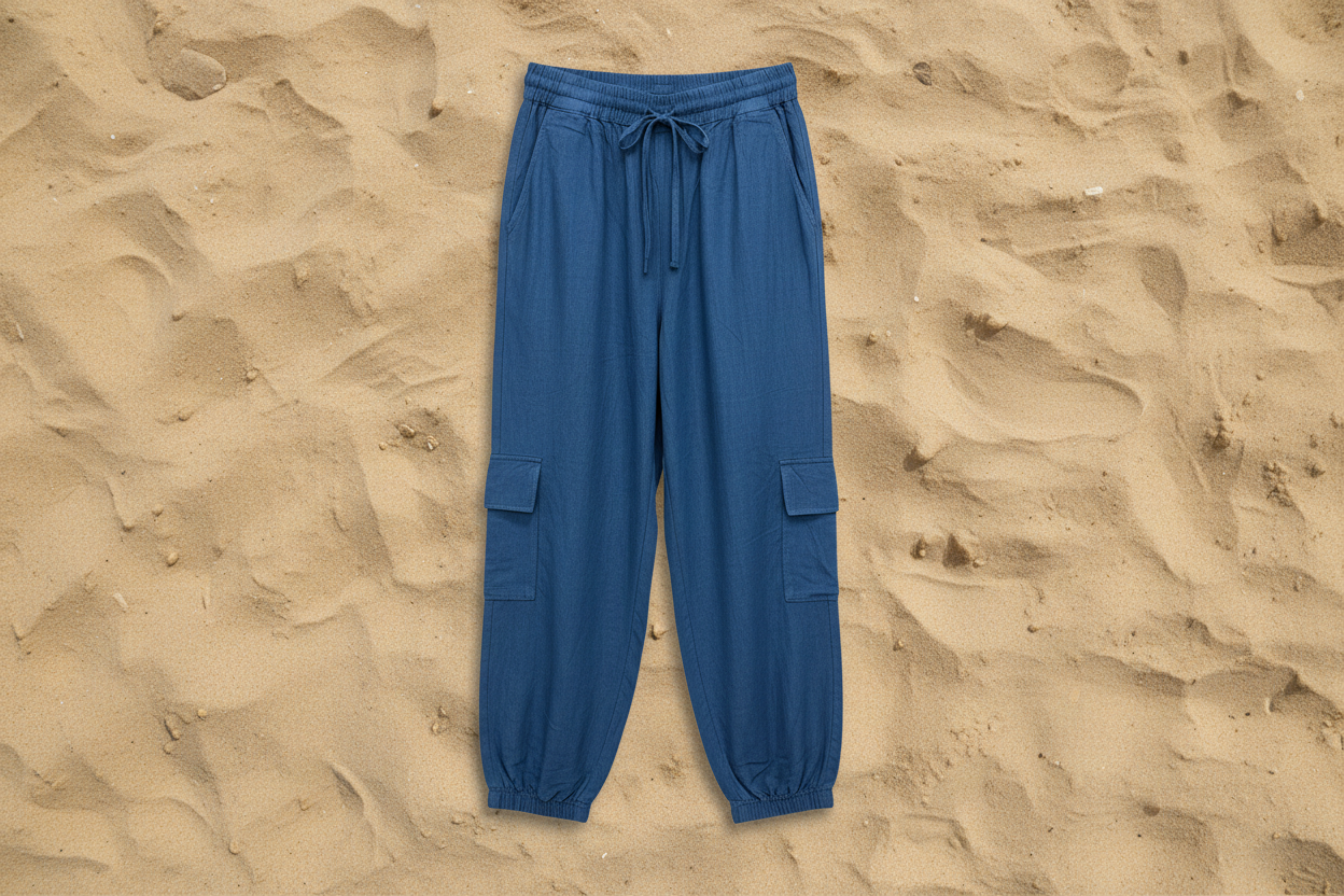 Blue cargo pants on a sandy background