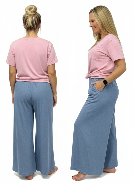 Woman wearing a pink shirt and blue pants, shown from front and back on a white background.