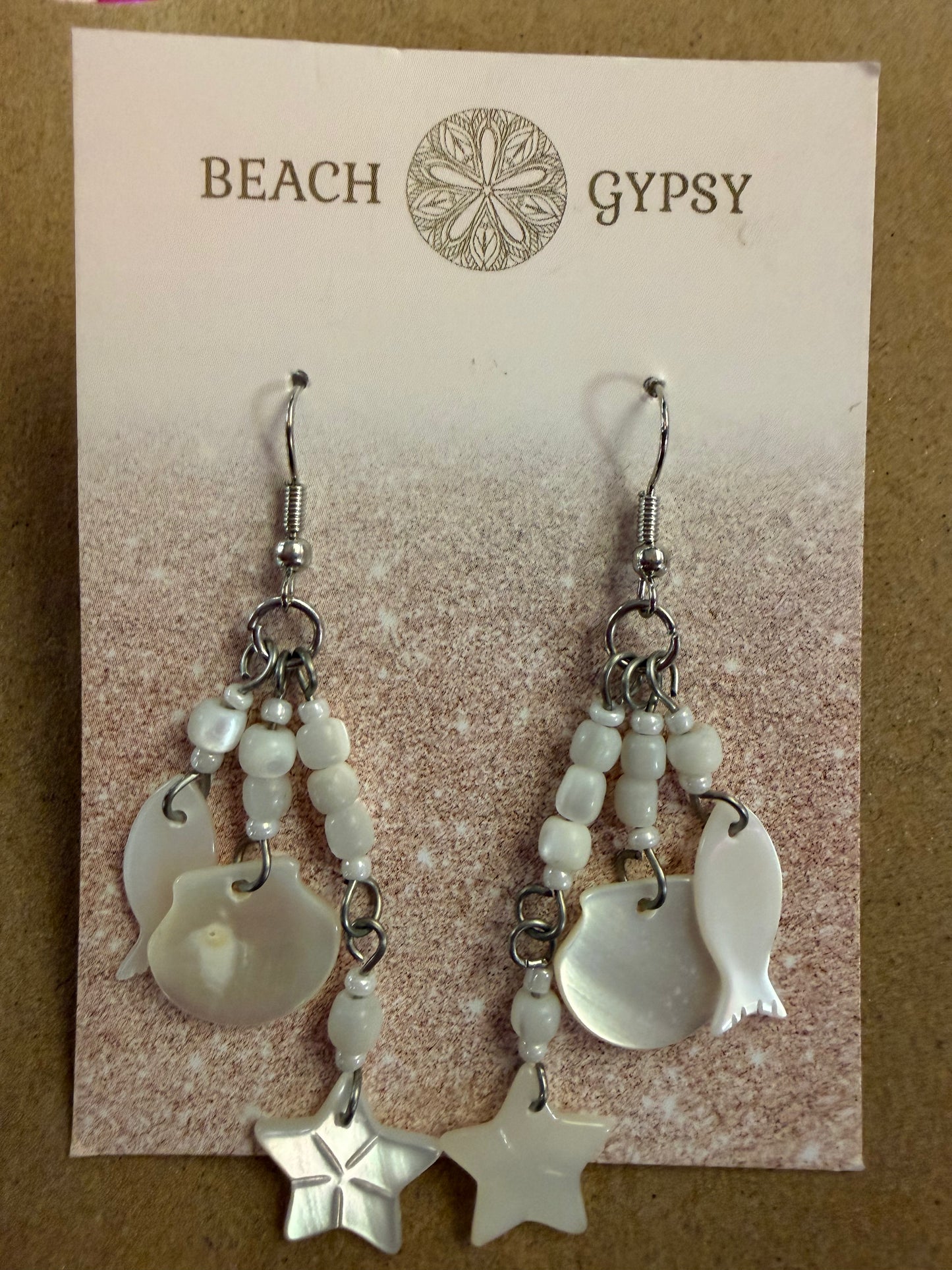 Pair of earrings on a 'Beach Gypsy' branded card