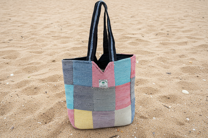 Natural hemp tote bag with zipper on sand
