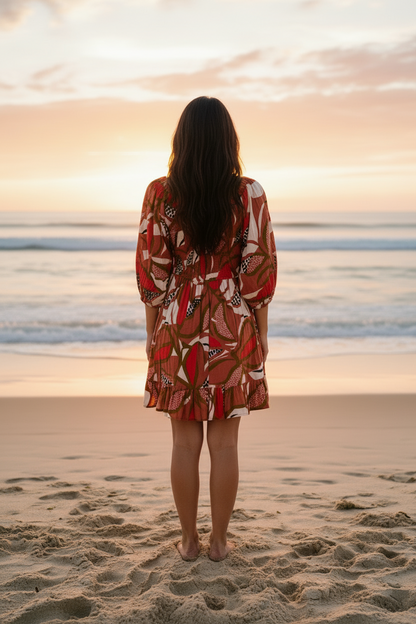Back view of Dragonfruit Peasant Dress on woman with back facing the viewer