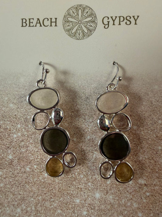 Brown sea glass dangle earrings on Beach Gypsy branded card