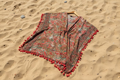 Red Poncho on a sandy background