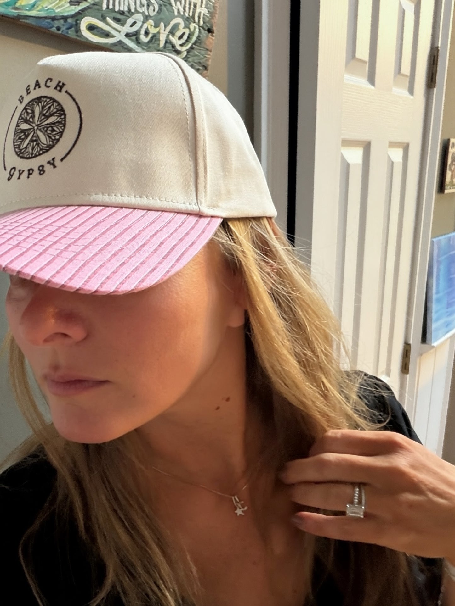 Beautiful woman in a pink striped brim and canvas Beach Gypsy trucker hat