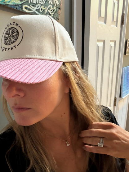Beautiful woman in a pink striped brim and canvas Beach Gypsy trucker hat