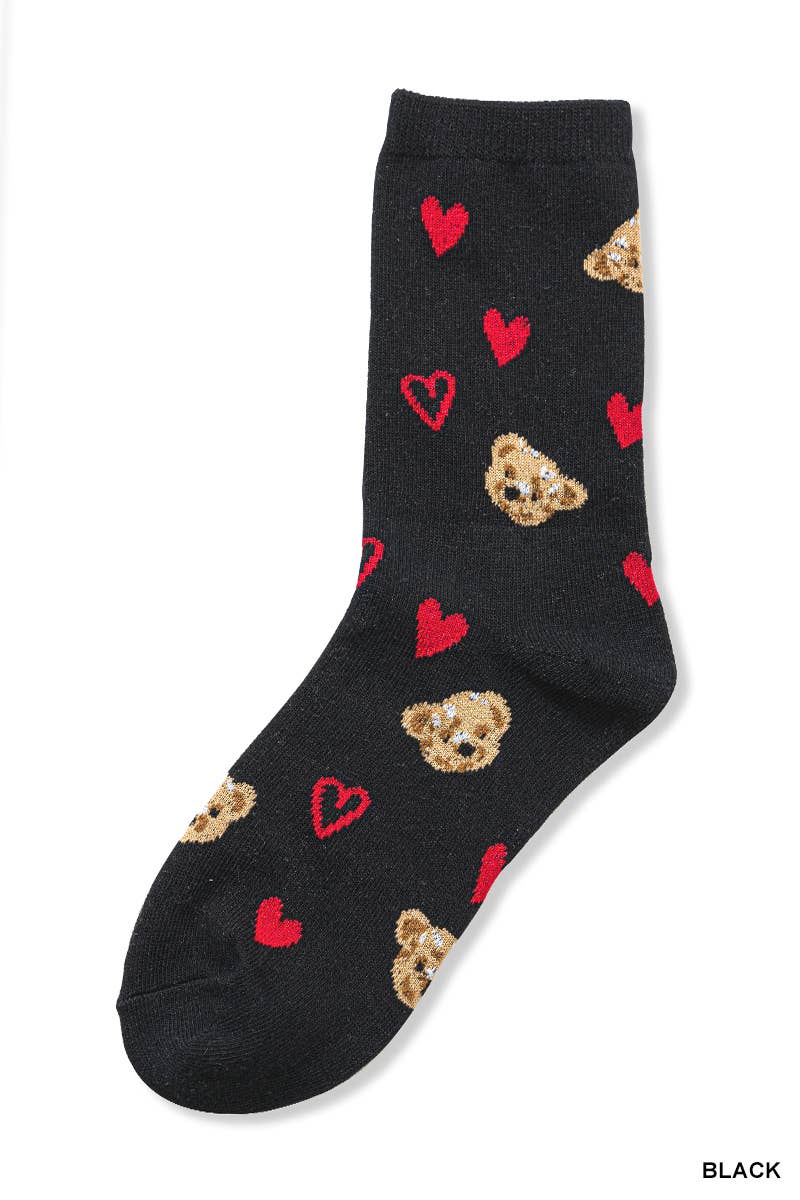 Black sock with teddy bear and heart patterns on a white background