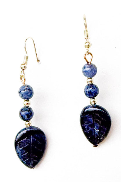 Pair of blue beaded earrings on a white background