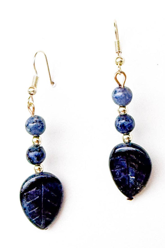 Pair of blue beaded earrings on a white background