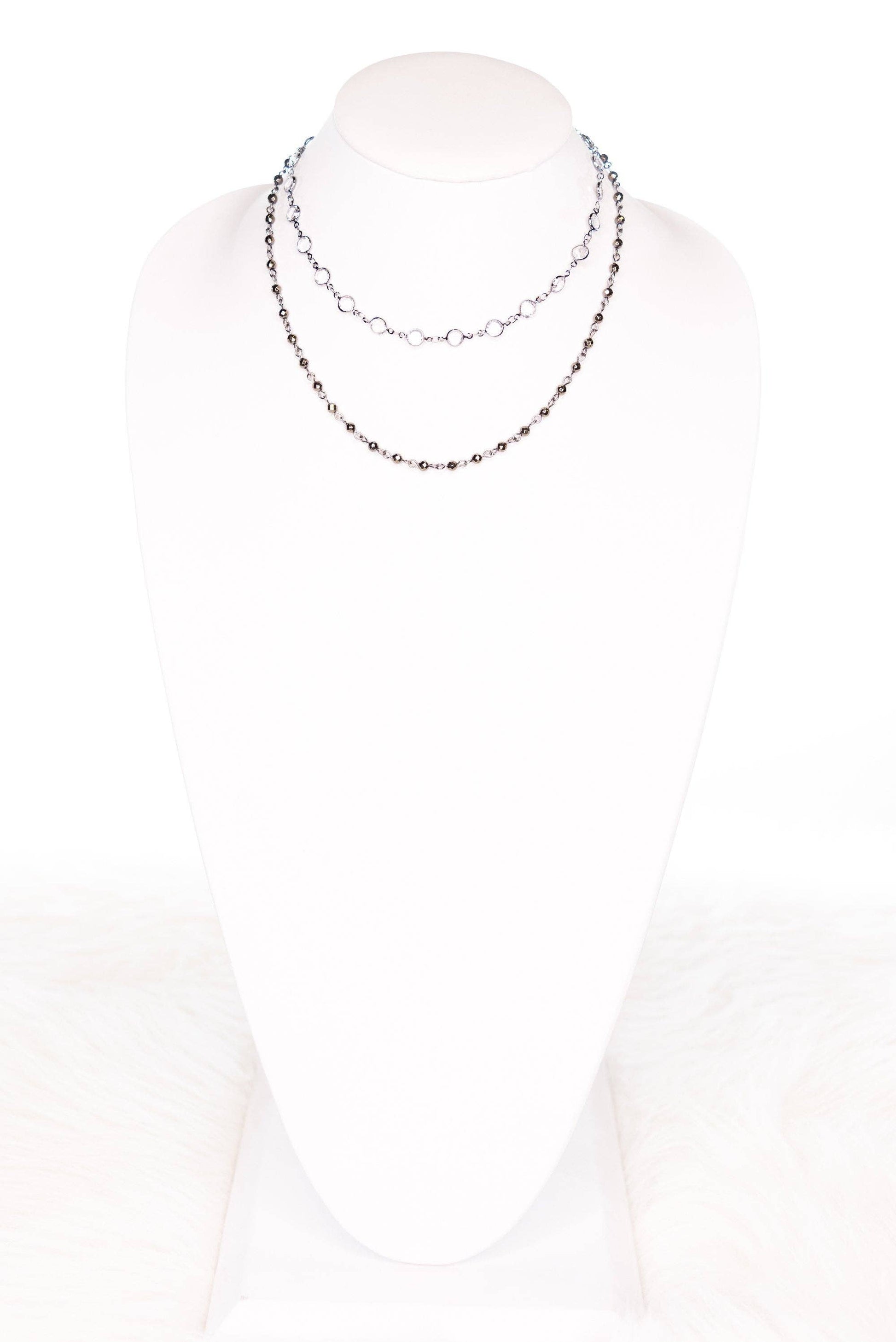 Necklace on a mannequin with a white background