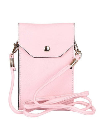 Pink lightweight crossbody bag with a buckle detail, displayed near a vintage photo