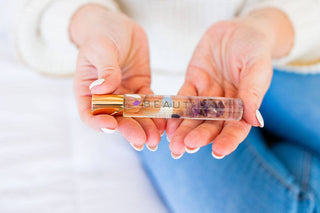 Crystal Roller Natural Perfume bottle displayed upright, showing its label and cap design