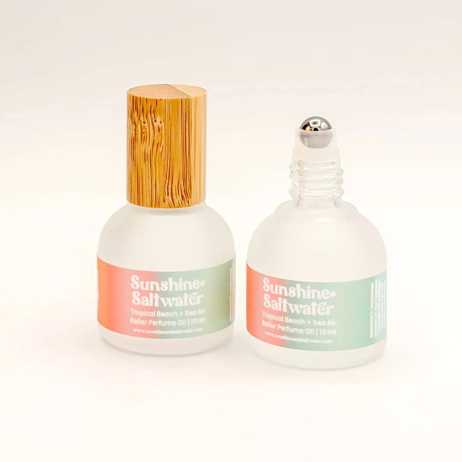 Two bottles of 'Sunshine Saltwater' perfume on a white background