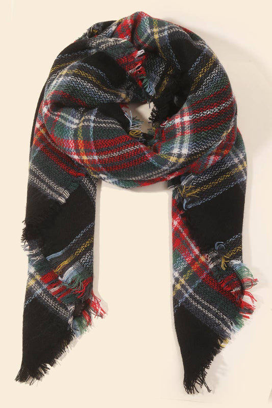 Plaid scarf with frayed edges on a beige background