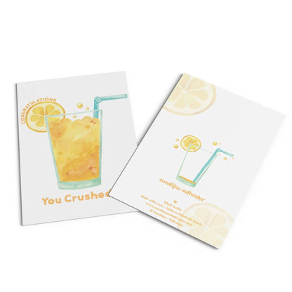 Congratulations card with an orange drink on it on white background