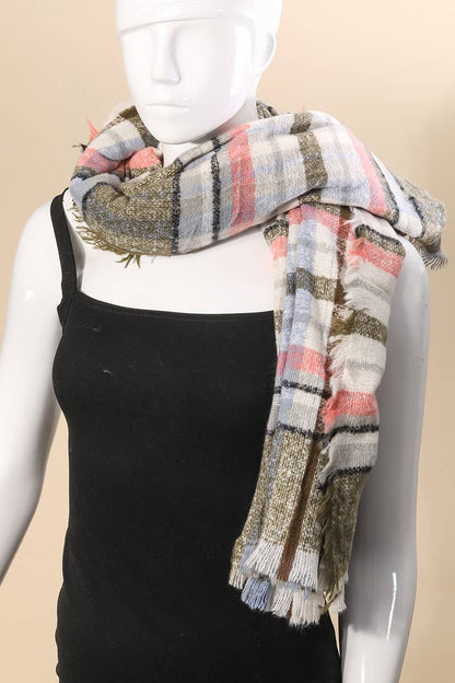 Plaid scarf draped around a mannequin with a plain background