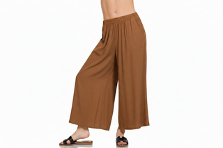 Brown flowy pants on a woman