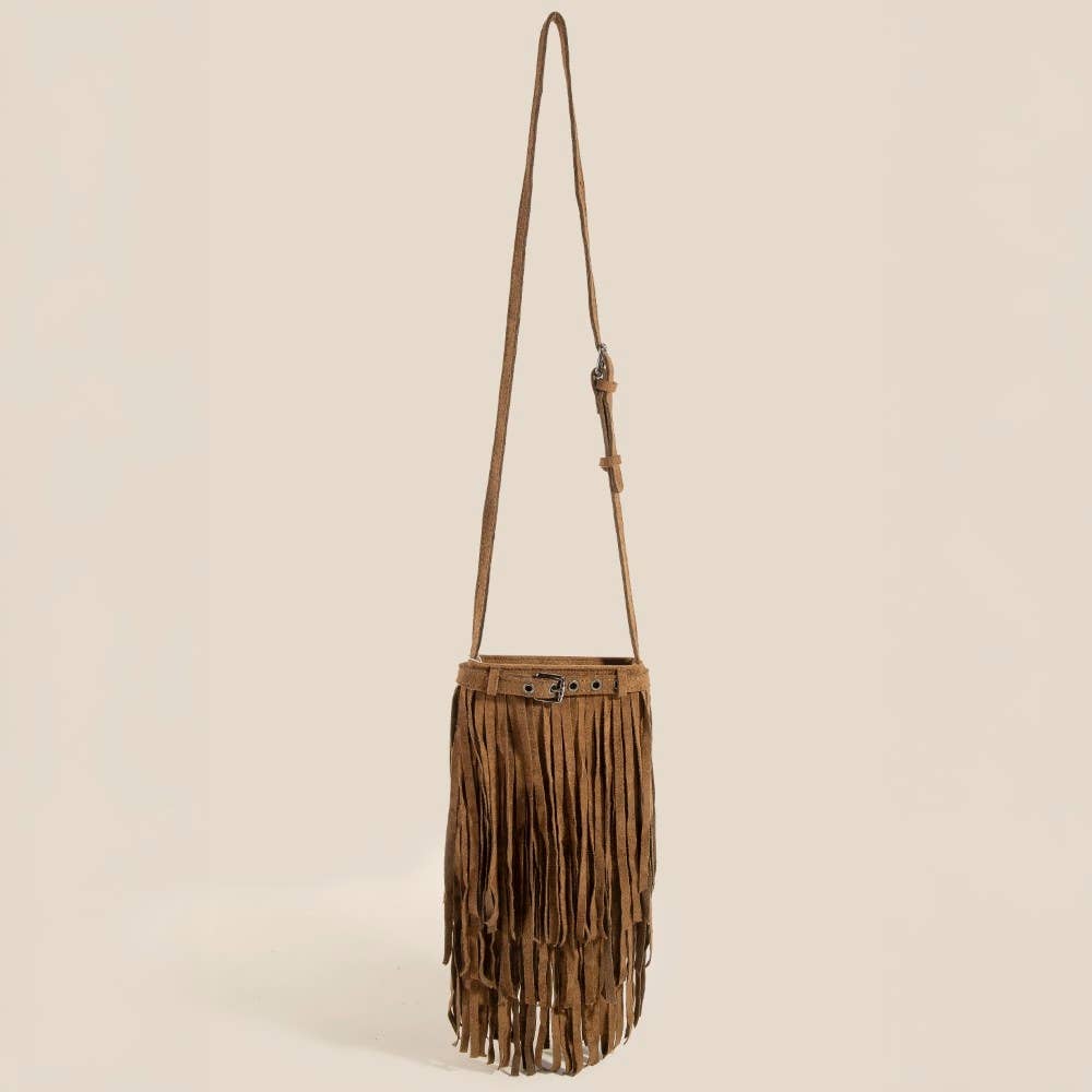Brown fringe bag with a strap on a beige background