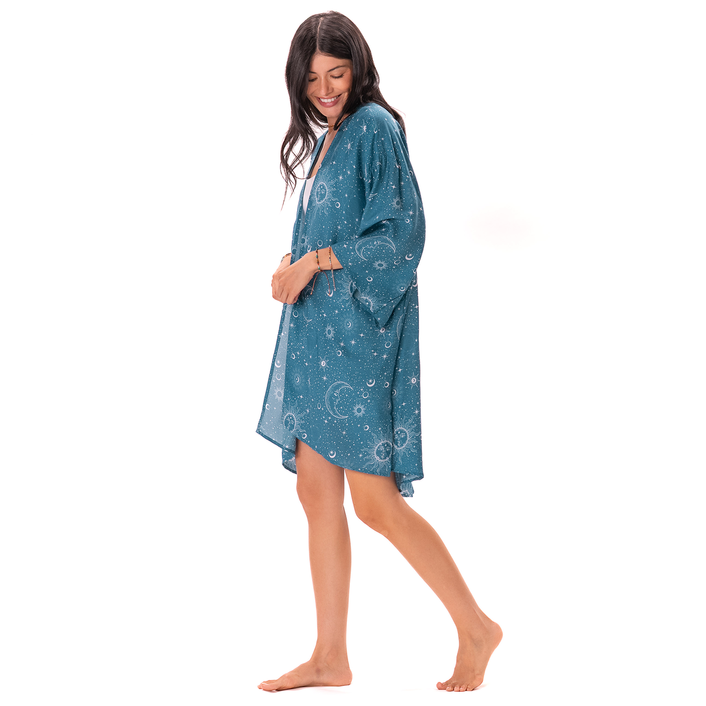 Woman wearing a blue patterned kimono on a white background