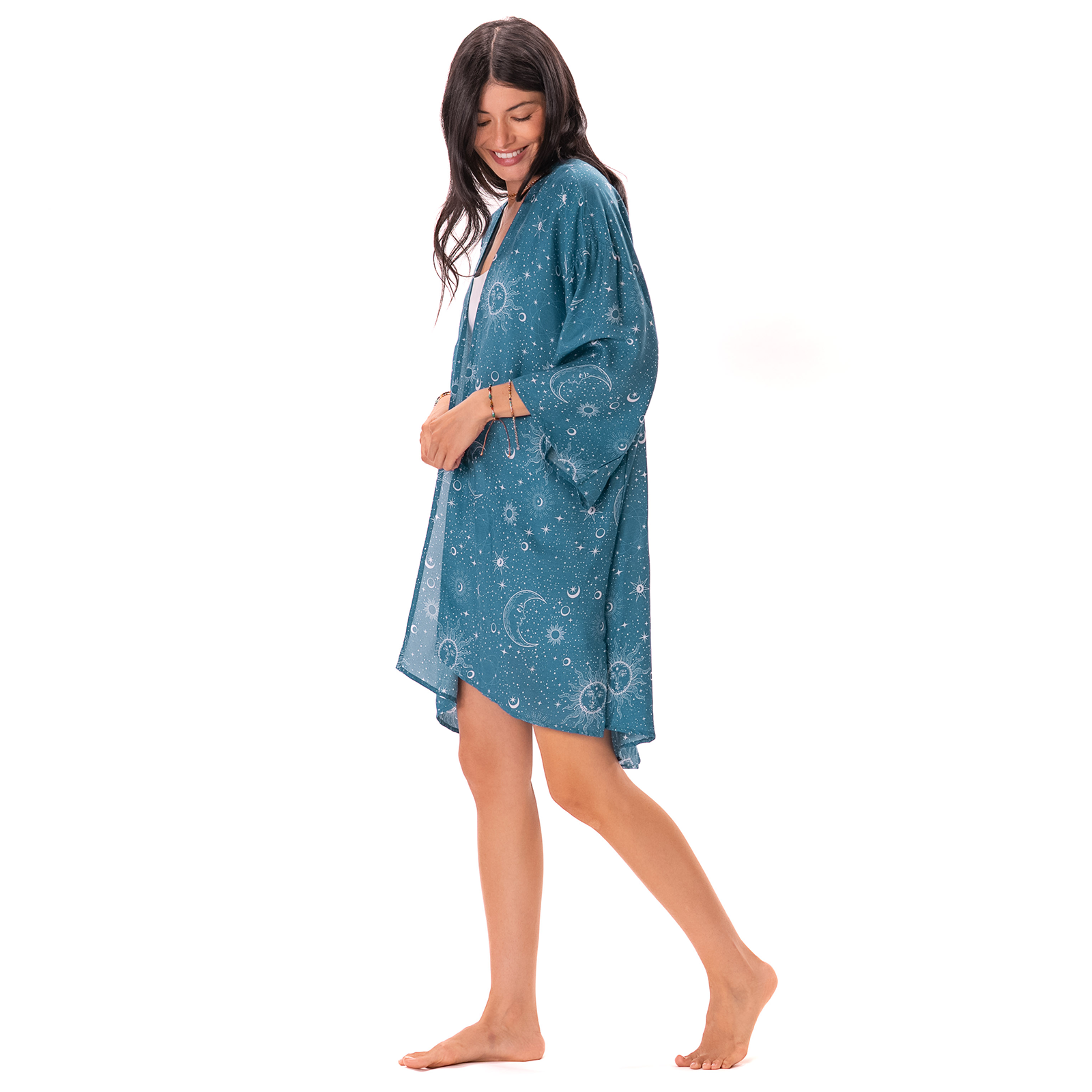 Woman wearing a blue patterned kimono on a white background