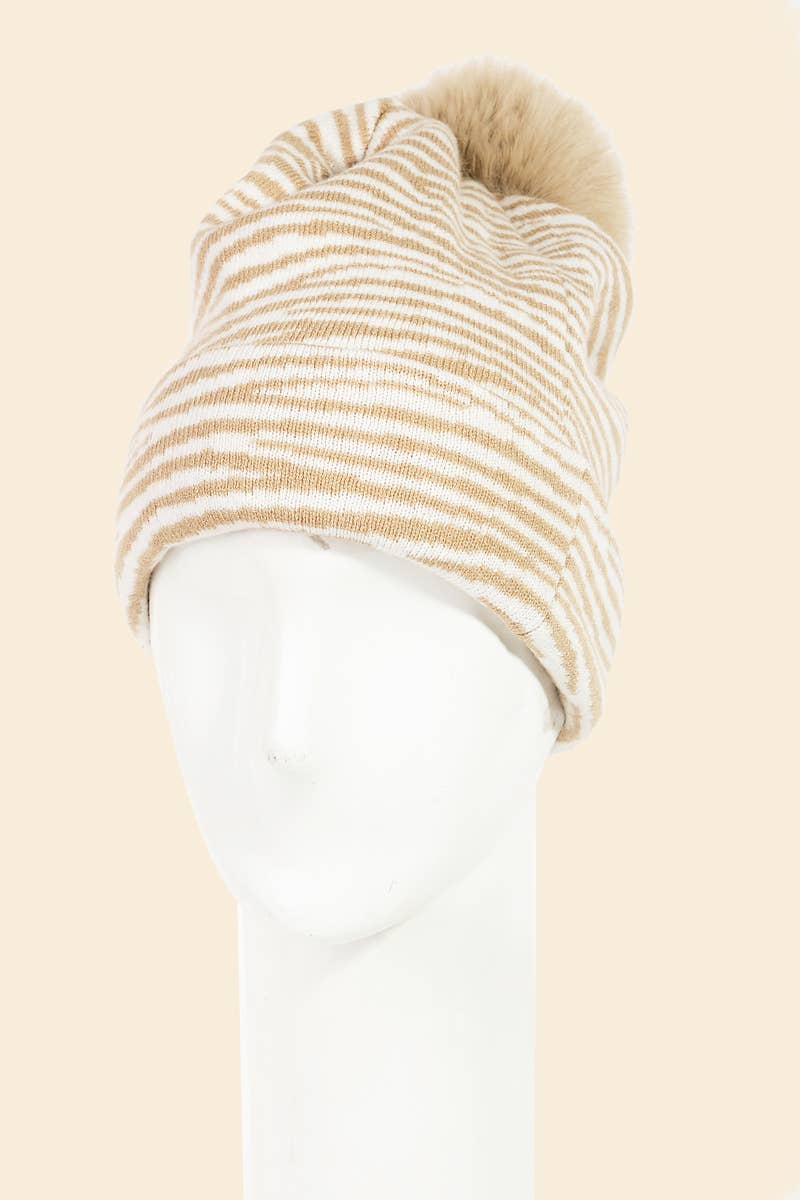 Beige and white striped beanie on a mannequin head against a beige background