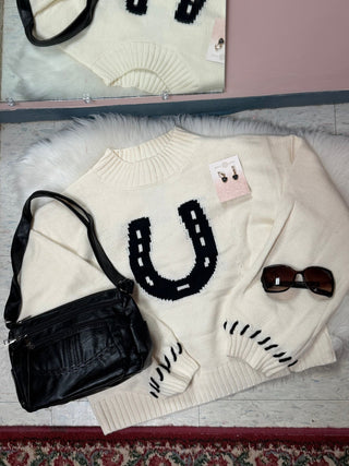 Horseshoe Knit Sweater shown from a side angle to display the knit texture and sole