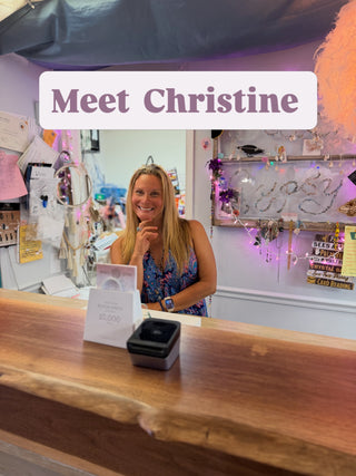 Meet Christine, owner of Beach Gypsy, smiling behind the counter of our Berlin, MD boutique