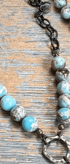 Juniper Necklace laid flat, highlighting its pendant design