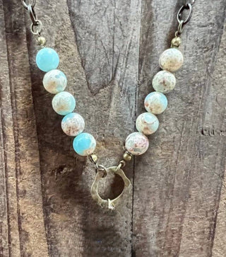 Juniper Necklace laid flat, highlighting its pendant design