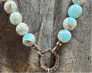 Juniper Necklace laid flat, highlighting its pendant design
