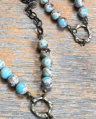 Juniper Necklace laid flat, highlighting its pendant design