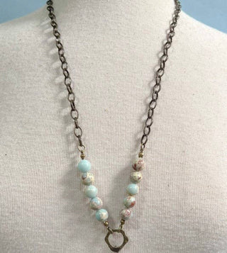 Juniper Necklace laid flat, highlighting its pendant design