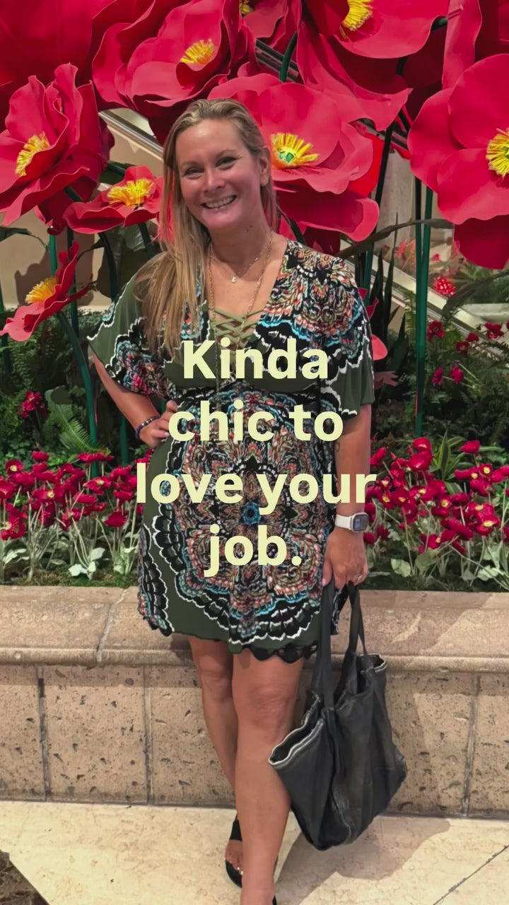 Christine, owner of Beach Gypsy, smiling in front of red poppies: Kinda chic to love your job