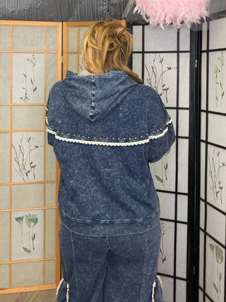 Lace Trim Washed Denim Hooded Zip Jacket shown on a hanger or flat lay, highlighting its lace trim texture in denim