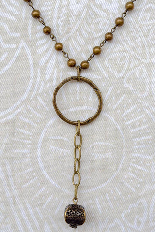 Lanie Bronze Beaded Lariat Necklace laid flat, highlighting its beaded design