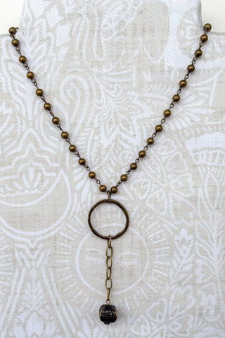 Lanie Bronze Beaded Lariat Necklace laid flat, highlighting its beaded design