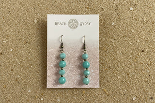 Close-up of Mari Earrings in Amazonite dangle earrings laid flat, showing their amazonite detail