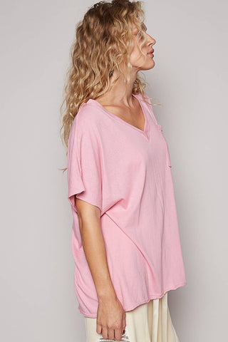 Oversized V-Neck Tee laid flat or shown on a model, highlighting its boho fabric and neckline