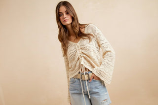 Pointelle Knit Ruched V-Neck Sweater shown on a hanger or flat lay, highlighting its pointelle texture