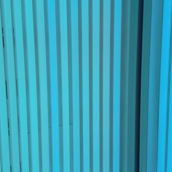 Close-up of the stand-up UV tanning bed (Pink Sands Room) at Beach Gypsy in Berlin, MD